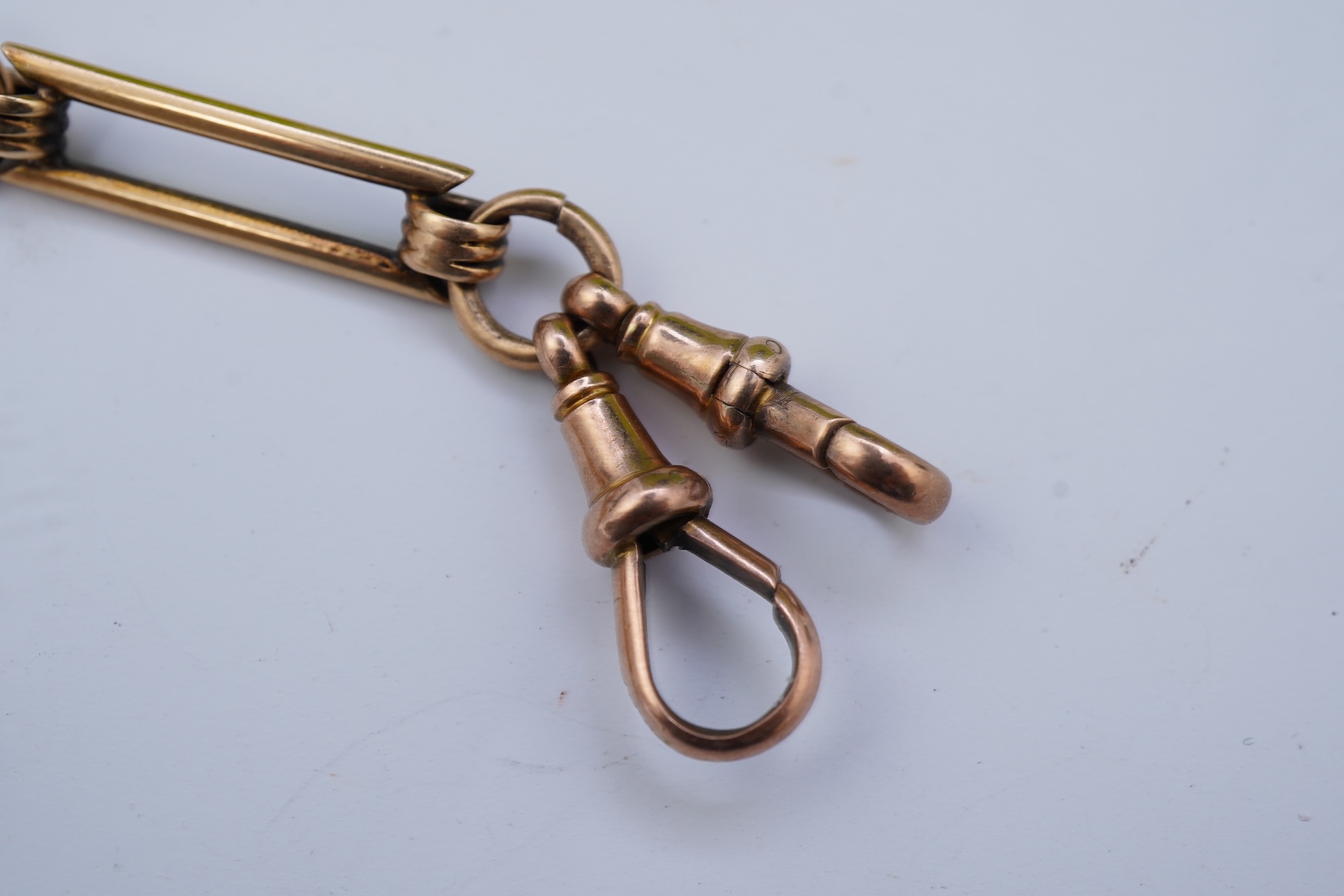 A continental 18k gold open faced keyless lever pocket watch, with a 9ct albert
